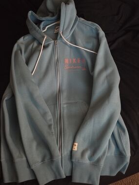 Nike Light Blue Zip-Up Hoodie with Pink Logo